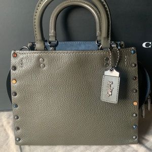 COACH ROGUE 25 WITH RIVETS NWT